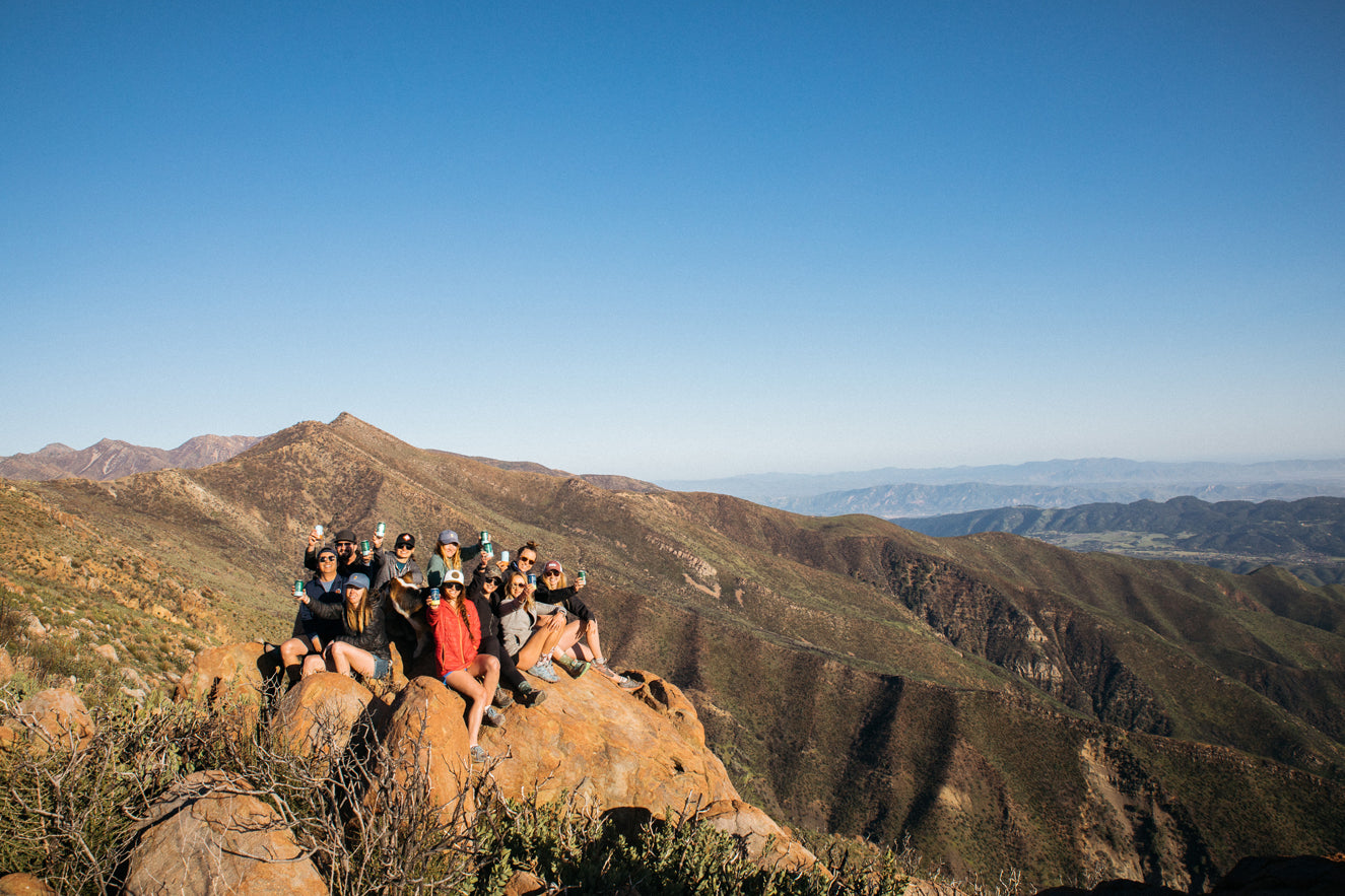 Group of people on the top of mountain peak