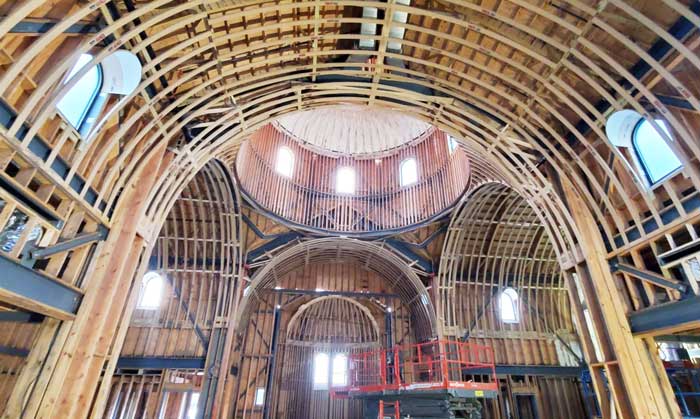 Arches being built in a church using archway kits from Archways and Ceilings
