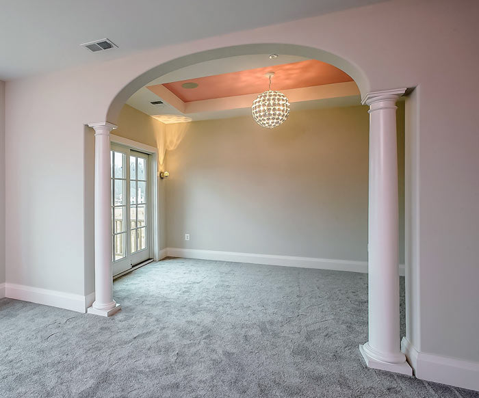 Elliptical arch with columns on the side for a Federal-style home interior