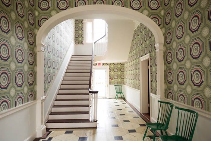 Patterned green wallpaper in a Federal-style landmark at the Dumbarton House in Washington DC