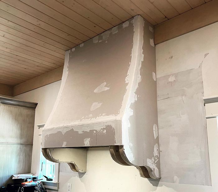 The range hood frame after drywall and taping and joint compound applied