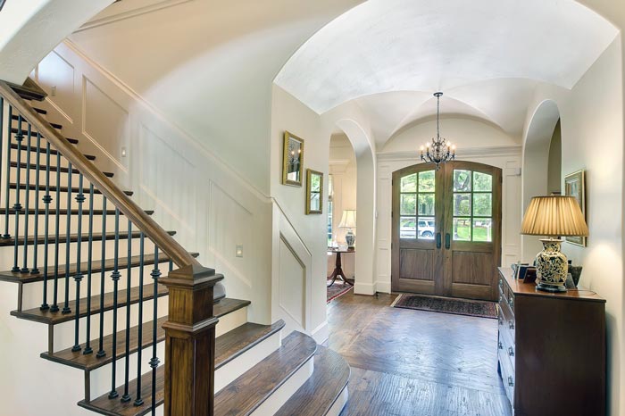 Traditional Foyer with groin vault ceiling and arched entryways