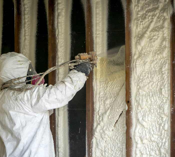 Closed-cell foam insulation being applied for a wine cellar