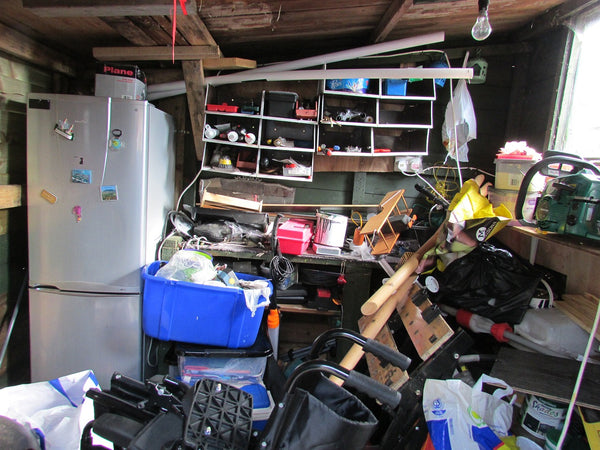 Cluttered garage BEFORE a Duramax Shed Duramax Sheds Direct