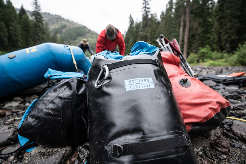 warerproof Mustang Survival bags on river rafing trip 