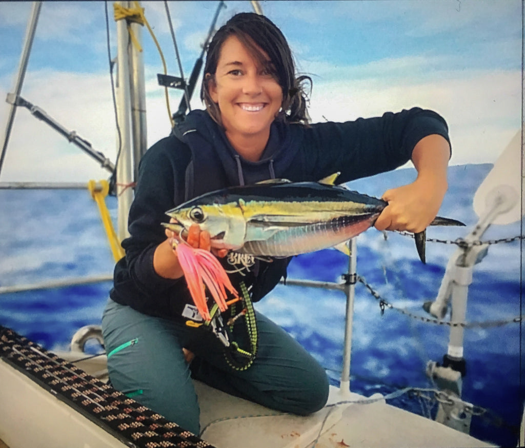 Celeste Brooke-Landon fishing from her sail boat 