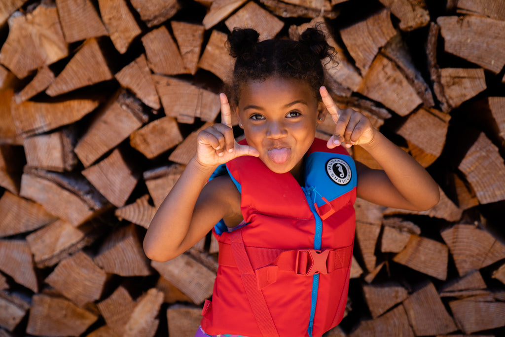 Little girl in little Legends foam PFD