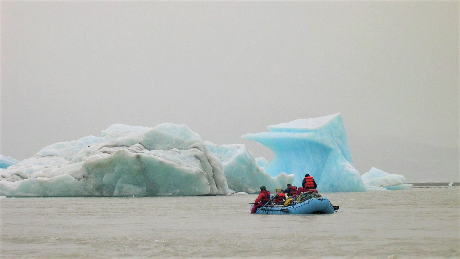 team of rafters by icebergs