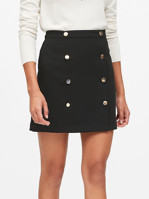 black skirt with gold buttons