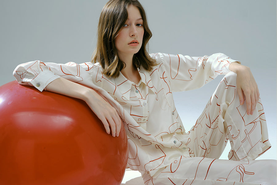 Woman with beautiful red silk pajama set