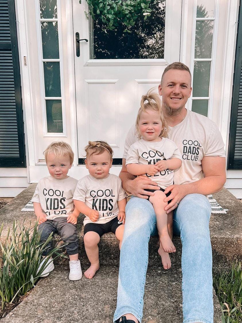 A dad and his son and daughters wearing cute Father's Day shirts