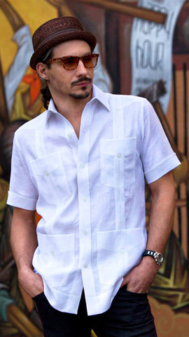 young-adult-wearing-a-white-Ramon-Puig-guayabera-with-glasses-and-hat