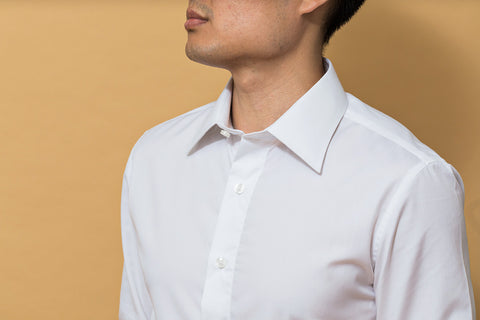young-adult-wearing-a-white-button-up-shirt