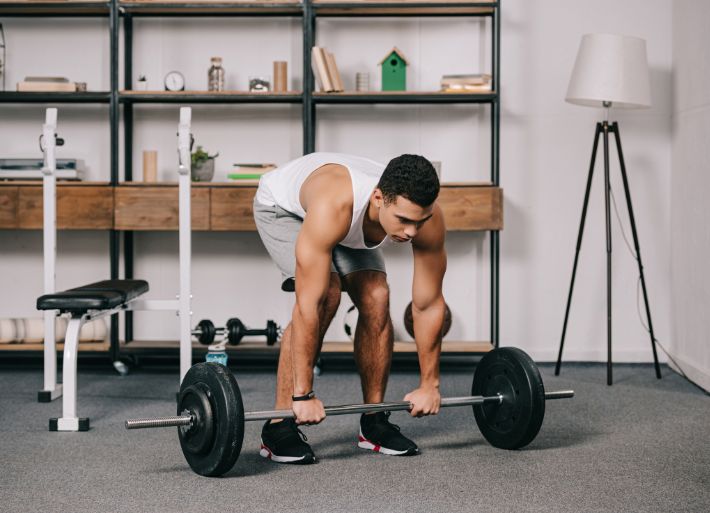 Athlete exercising in home gym