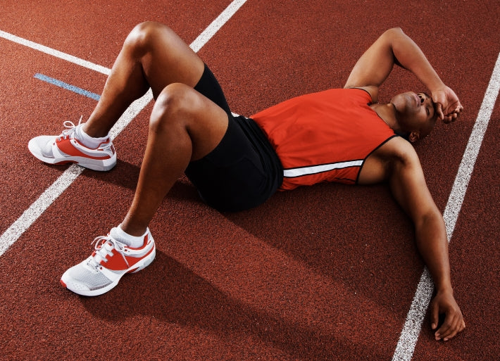 Athlete sleeping on track