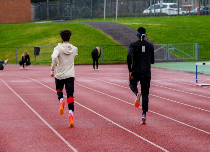 Destiny Ogali sprinting with teammate