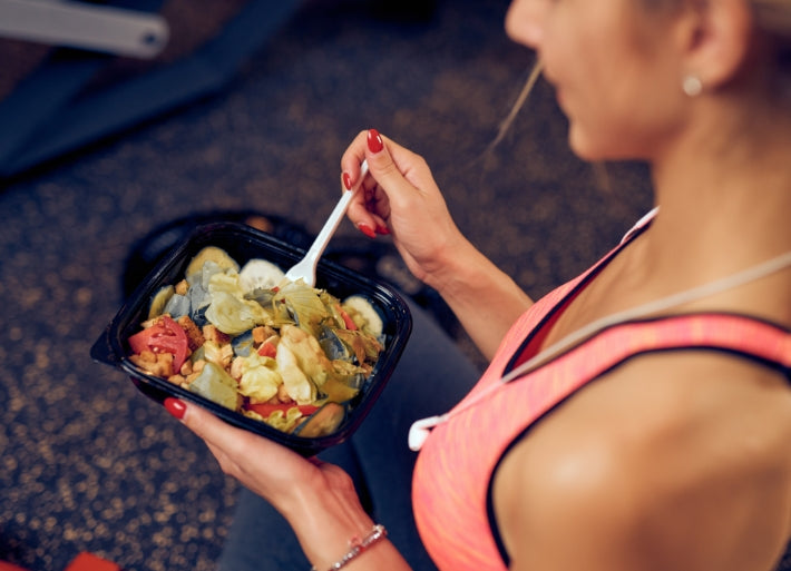 Female athlete eating healthy food