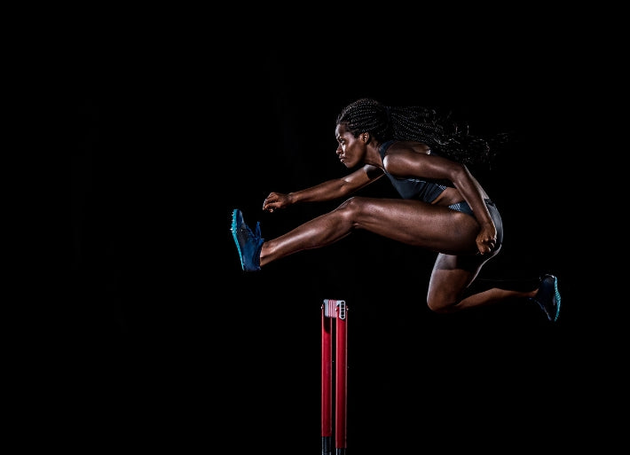 Female athlete hurdling