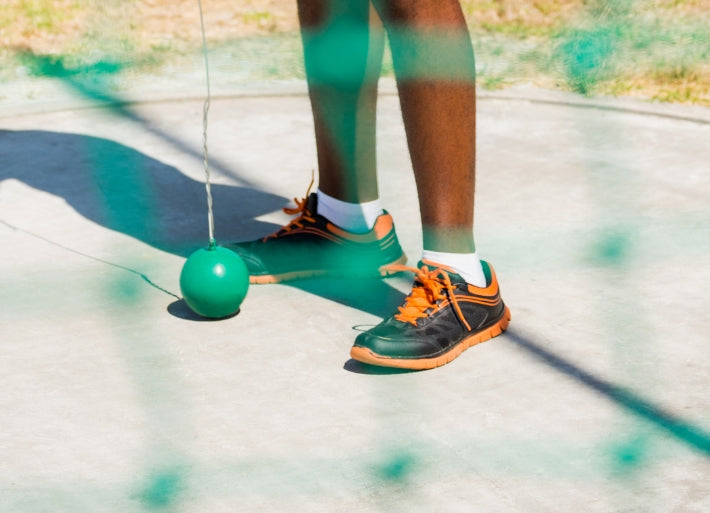 Hammer Throw athlete in cage