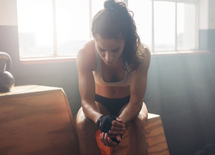 Female Athlete Thinking in the Gym