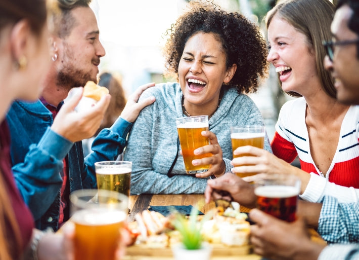 Athletes Drinking Beer with Friends