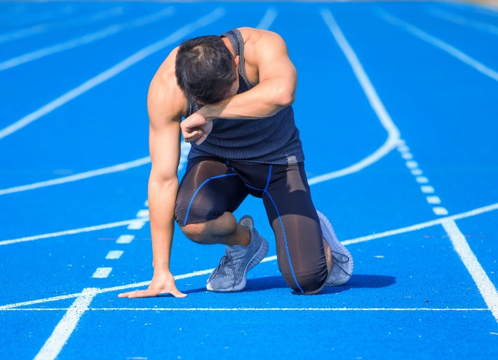 Tired Athlete Breathing after Running