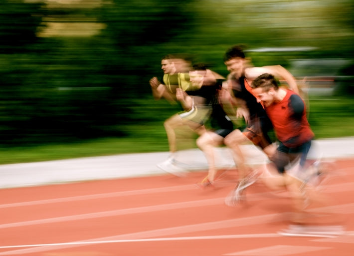 Male athletes sprinting