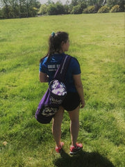 Prize winner Sophie Mace modelling Nelco discus kitbag