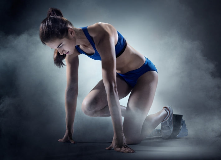 Female Sprinter Preparing for Race