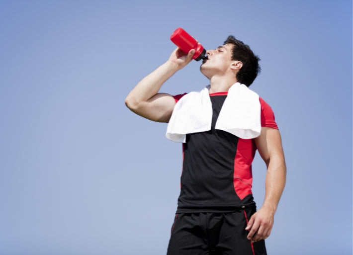 Male Throws Athlete Drinking Water