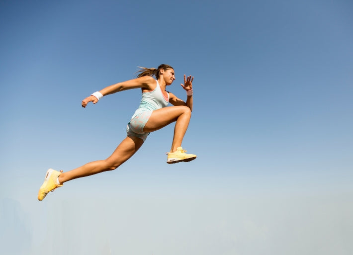 Woman taking long jump