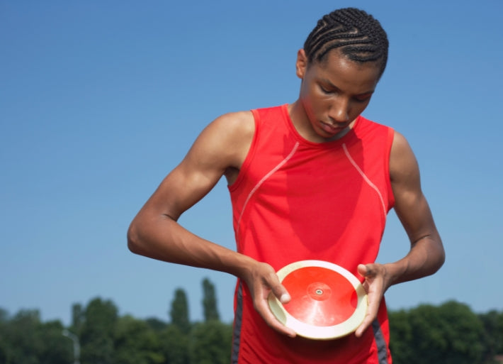 Young athlete with discus