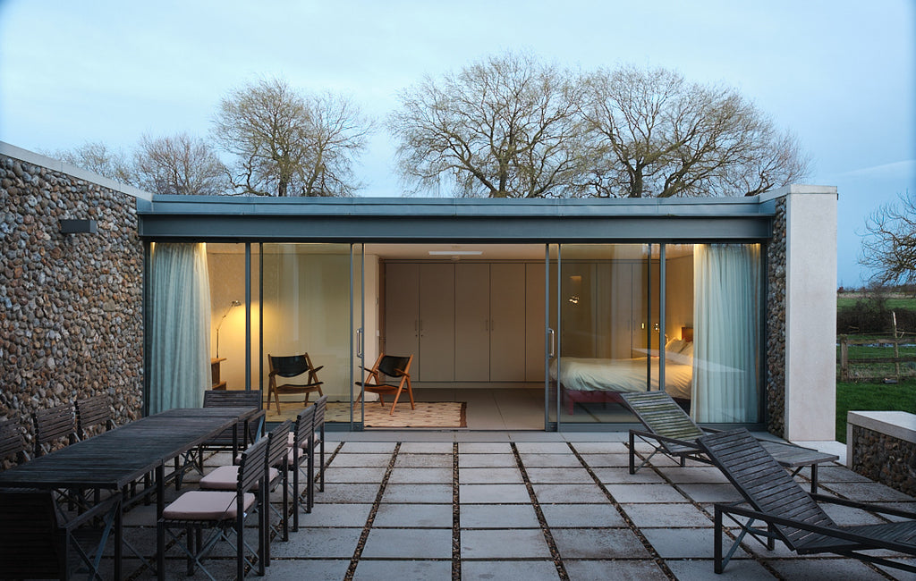 Patio, sliding glass doors with view into bedroom. Living Architecture.