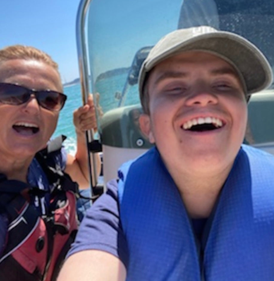 Jo Sheppard supporting a young person on a boat adventure with Head Outdoors