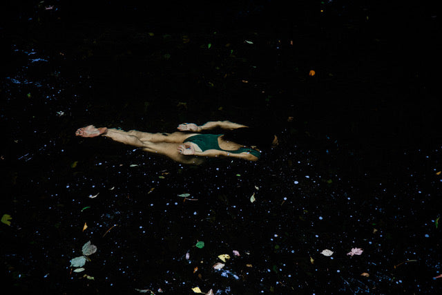 Underwater photograph of woman swimming.