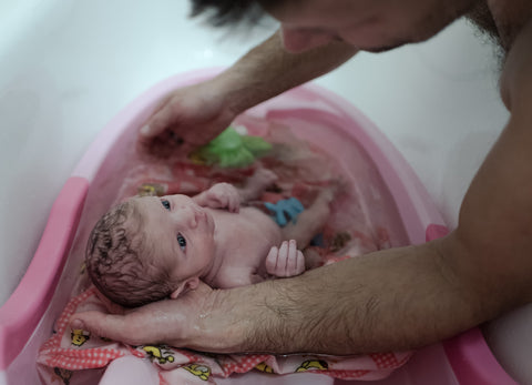 Bath time and other baby care are excellent ways to build a bond with your child.