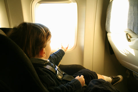 It's safest and simplest for your child to have their own plane seat.