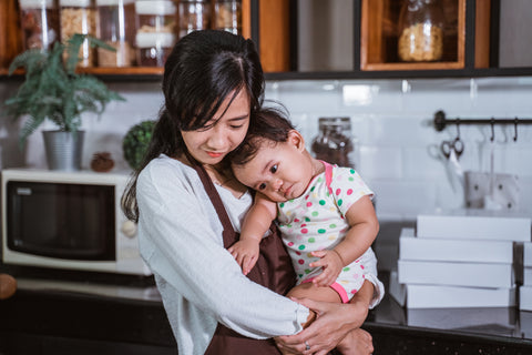The bökee makes cooking and food prep much simpler, even when holding a child.