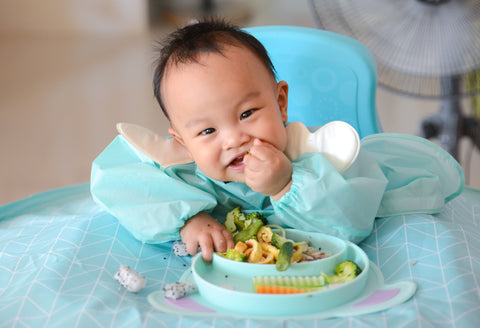 Fish and eggs are common first foods for babies in Asia,