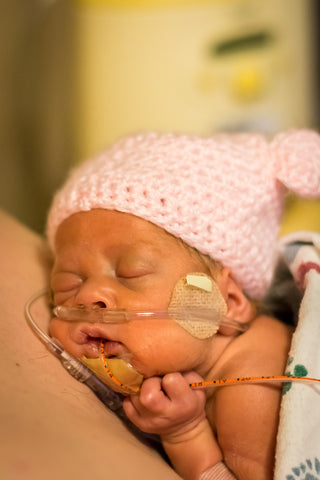 Skin-to-skin time is crucial for you and your preemie as soon as the doctors allow it.