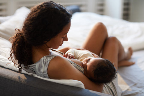 woman of color breastfeeding her baby to reinforce concept of equity in breastfeeding