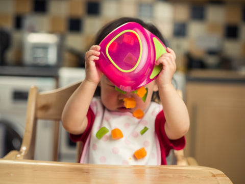 It can be fun and messy to introduce solid foods to your child.