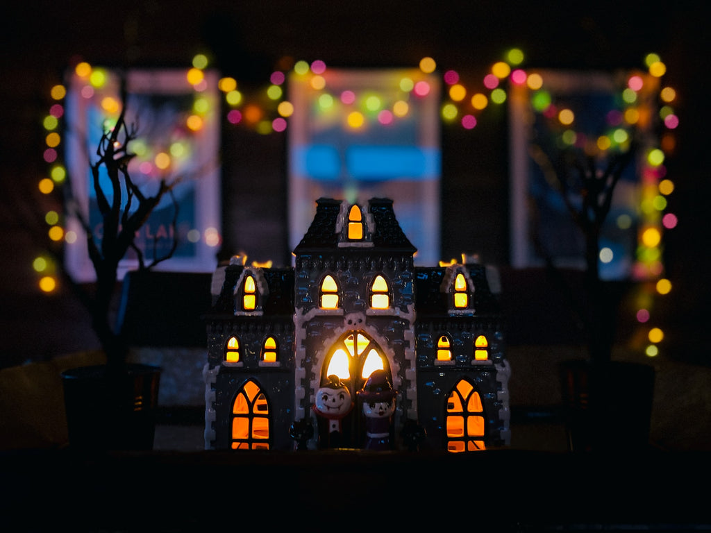 lit haunted house decoration with fairy lights