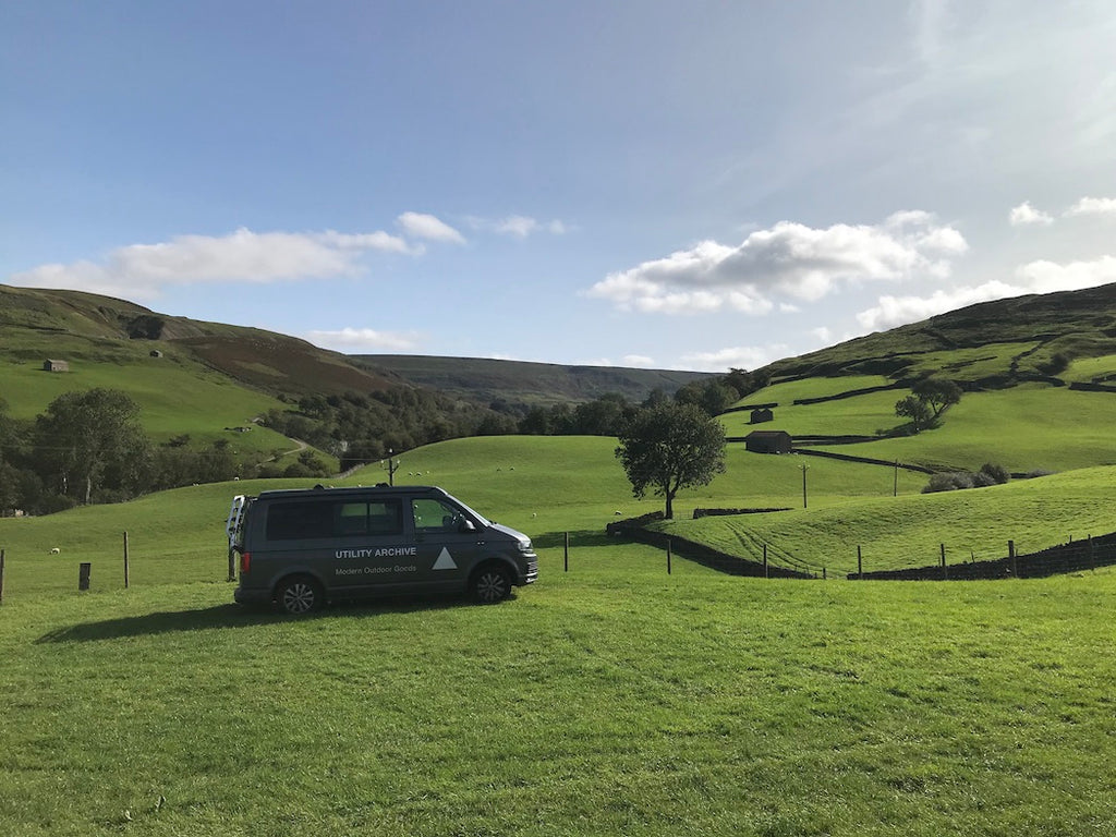 View down green valley with Utility Archive VW T6 campervan