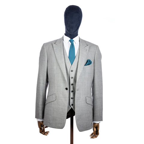 Airforce Blue Knitted tie and pocket square with grey suit on a mannequin - centre