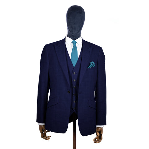 Airforce Blue Knitted tie and pocket square with navy suit on a mannequin - centre