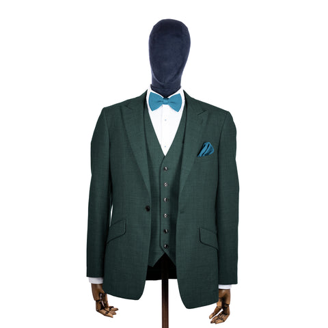 Airforce Blue knitted bow tie and pocket square with green suit on a mannequin-BroniandBo