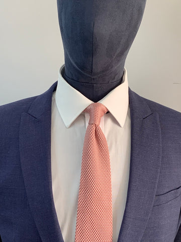 Antique rose knitted tie and navy suit