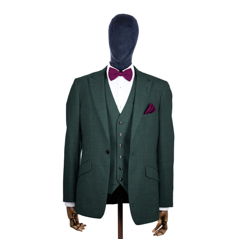 Berry Pink knitted bow tie and pocket square with green suit on a mannequin-BroniandBo