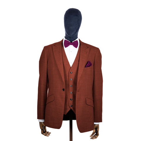 Berry Pink knitted bow tie and pocket square with rust suit on a mannequin-BroniandBo